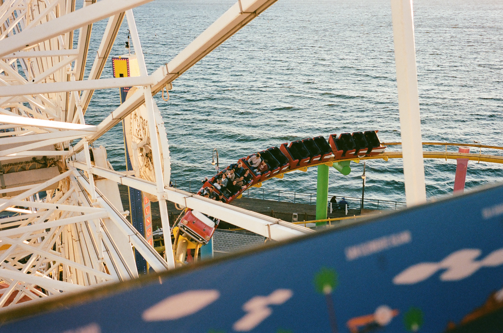 rollercoaster track seen from above the ocean
